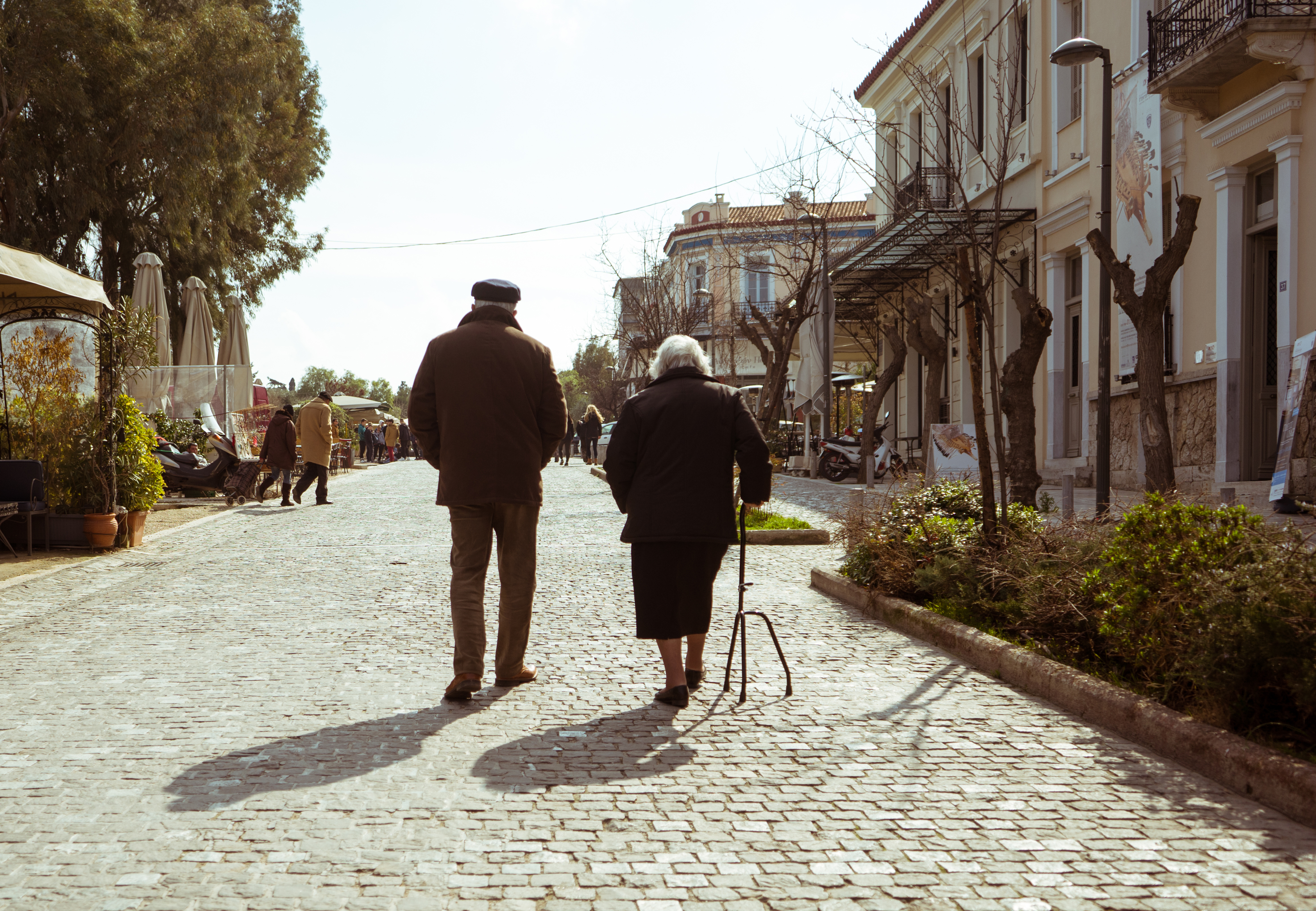 Mature,Couple,Walking,In,A,Street,Of,Athens